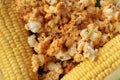 Popcorn with butter and fresh corn cob.