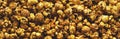 Popcorn	in caramel. Background. Texture. Panorama. Royalty Free Stock Photo