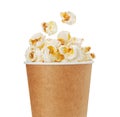 Popcorn in a cardboard cup isolated on white background Royalty Free Stock Photo