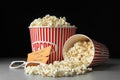 Popcorn, cinema tickets and 3d glasses on grey Royalty Free Stock Photo