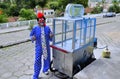 Popcorn clown Mineirinho with his popcorn cart standing on the street