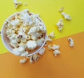 Popcorn on a colored background top view fat salty food