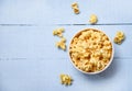 Popcorn in cup bowl and blue wooden  backgroubd top view / Sweet butter popcorn salt Royalty Free Stock Photo