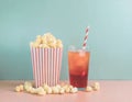 Popcorn and a drink in pastel colors Royalty Free Stock Photo