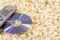 Popcorn dvd disc and remote Royalty Free Stock Photo