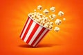 Popcorn Exploding from a Red and White Striped Bucket Royalty Free Stock Photo