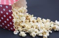 Popcorn falling out of the box on black background