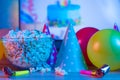 Popcorn with festive accessories on the background of TV. Watching TV on the occasion of a family celebration or in a circle of