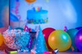 Popcorn with festive accessories on the background of TV. Watching TV on the occasion of a family celebration or in a circle of