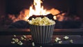 Popcorn by the Fireplace - A Snug Evening Treat. Concept Movie Night, Cozy Atmosphere, Relaxation,