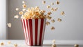 Popcorn Flying Out Of A Red and White Striped Box. Royalty Free Stock Photo