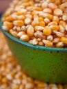 Popcorn kernels in a green bowl Royalty Free Stock Photo