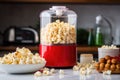 popcorn maker filled with freshly popped popcorn