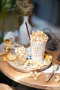 Popcorn milkshake. Sea salt caramel milkshake with popcorn toppings with soft focus on the caramel pop corn