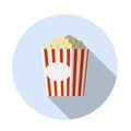 Popcorn. Movie theater snack. Corn meal in a red striped package in a blue circle. Funny icon. Flat cartoon illustration