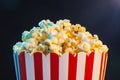 Popcorn over cinema light background, movie concept