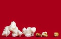 Popcorn over Vibrant Red Background Popped and Unpopped Kernels Royalty Free Stock Photo