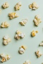 The popcorn in paper cup on green background. Royalty Free Stock Photo