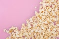 Popcorn on a pastel pink background and a place for text. Flat lay. Copyspace. Cinema Concept Royalty Free Stock Photo