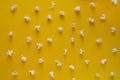 Popcorn pattern on yellow background. Top view. Contrast concept. popcorn on color background Royalty Free Stock Photo