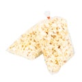 Popcorn in a Plastic Bag Tied with a Rubber Band on White Background Royalty Free Stock Photo
