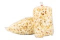 Popcorn in a Plastic Bag Tied with a Rubber Band on White Background Royalty Free Stock Photo