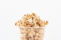 Popcorn in plastic cup on white background. Royalty Free Stock Photo