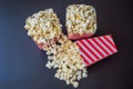 Popcorn in red and white container on a dark background Royalty Free Stock Photo