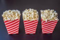 Popcorn in red and white container on a dark background Royalty Free Stock Photo