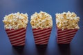 Popcorn in red and white container on a dark background Royalty Free Stock Photo