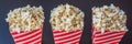 Popcorn in red and white container on a dark background BANNER, LONG FORMAT Royalty Free Stock Photo