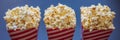 Popcorn in red and white container on a dark background BANNER, LONG FORMAT Royalty Free Stock Photo