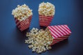 Popcorn in red and white container on a dark background Royalty Free Stock Photo