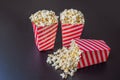 Popcorn in red and white container on a dark background Royalty Free Stock Photo