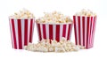Popcorn in red and white striped cardboard bucket isolated on white background Royalty Free Stock Photo
