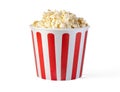Popcorn in red and white striped cardboard bucket Royalty Free Stock Photo