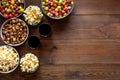 Popcorn and soda - cinema snacks - on wooden table from above space for text Royalty Free Stock Photo