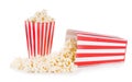 Popcorn spilled from a square box isolated on white background Royalty Free Stock Photo