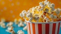Popcorn in Striped Container with Colorful Background