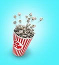 Popcorn in a striped red glass flies 3d render on a gradient background