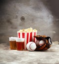 Popcorn on the table with draft beer. Baseball party food with balls for the playoffs