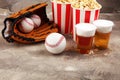 Popcorn on the table with draft beer. Baseball party food with balls for the playoffs