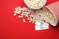 Popcorn and tickets on red background. Cinema snack Royalty Free Stock Photo