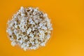 Popcorn viewed from above on yellow background. Close-up. Top view Royalty Free Stock Photo