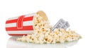 Popcorn was scattered out box and movie tickets, on white. Royalty Free Stock Photo