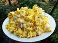 Popcorn on white dish