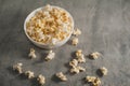 Popcorn in a white plate on a concrete background Royalty Free Stock Photo