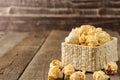 Popcorn in the Wicker baskets on the table woodbackground Royalty Free Stock Photo