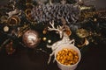 Popcorn in a wooden plate on the background of Christmas trees and Christmas decorations, New Year offer, selective focus