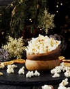 Popcorn in a wooden plate on the background of Christmas